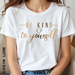 White top with Gold lettered slogan
